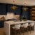 Defined by its clean architectural form, this handcrafted pendant light features a broad circular brass disc suspended...