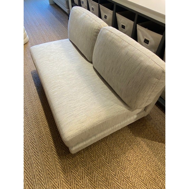 This i4 Mariani loveseat features a streamlined, armless silhouette that offers a modern and versatile seating solution...
