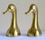 Elevate your library, office, or display shelves with this striking pair of vintage Mid-Century Modern solid brass mallard...