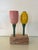 Cheerful Mid Century Modern turned wood salt and pepper shaker set on burl wood stand. the sculptural pair evokes stylized...