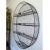 This uniquely large, four-shelf oval wire shelving unit has a beautiful vintage patina and is fully intact and stable. The...