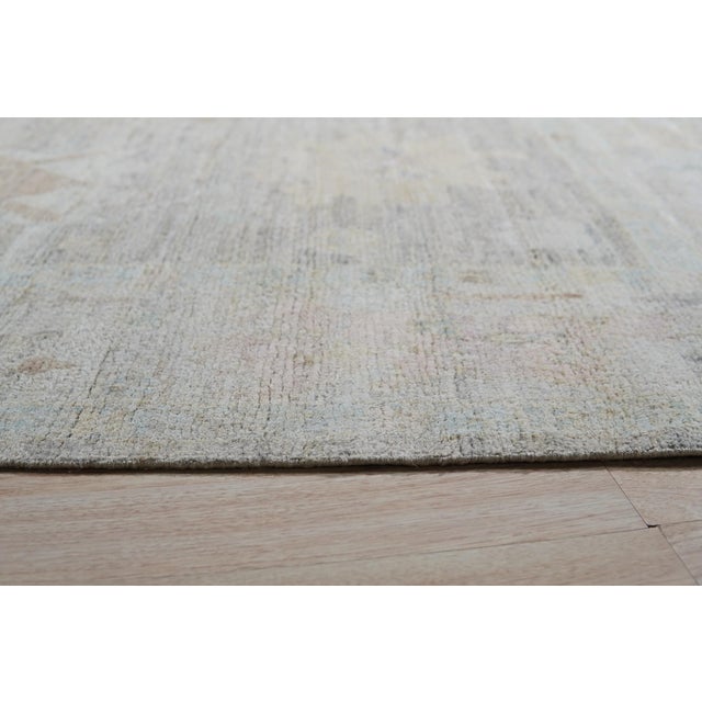 Ruby Fiona Ivory Hand Knotted Silk Rug, Country of Origin: India. This exquisite piece defines modern elegance, utilizing...