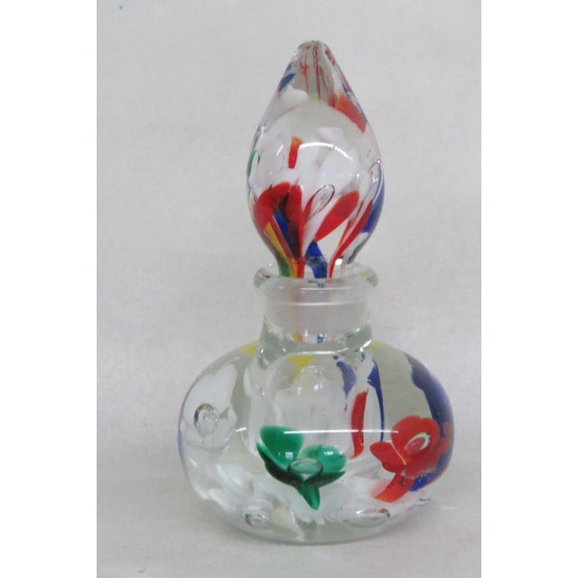 This wonderful vintage perfume bottle / paperweight is made out of hand blown glass. This lovely piece is stamped as being...