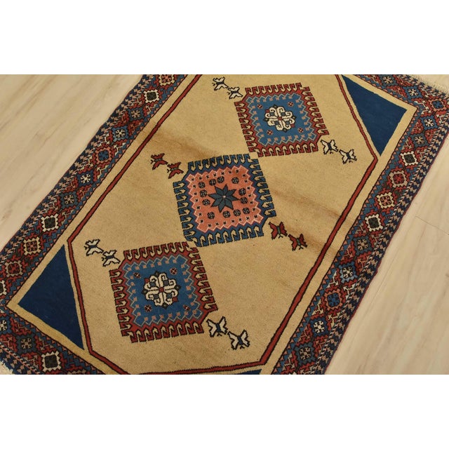 An authentic vintage tribal Yalameh rug hand-knotted with fine wool and natural dyes. This nomadic rug features geometric...
