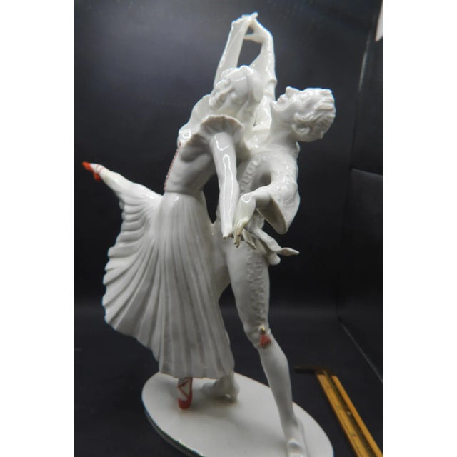 This marvelous dancing couple figurine is created in gorgeous cream colored porcelain with red, hand-painted details. This...