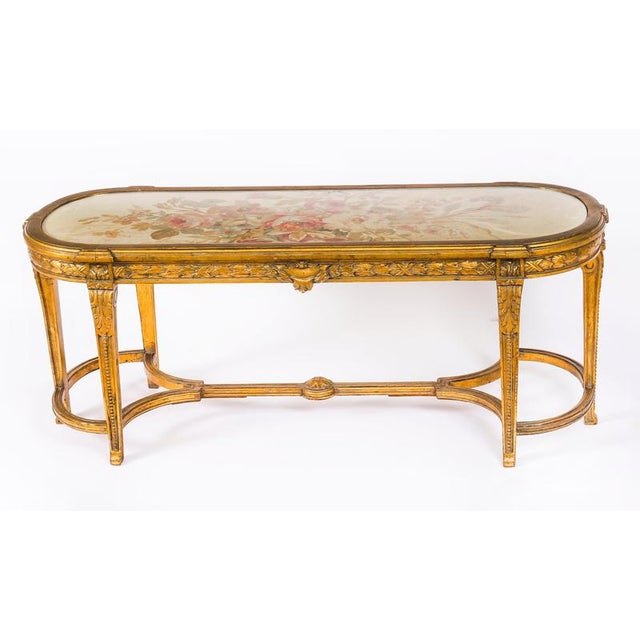 This is a stunningly beautiful antique French Louis XVI Revival giltwood and Aubusson tapestry low-table / coffee table...