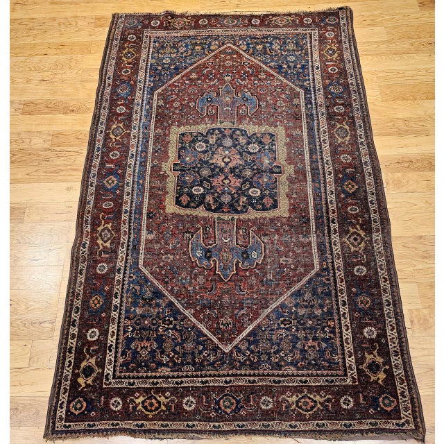 "19th century Persian Bidjar area rug with a medallion design in a Herati geometric pattern in burgundy, French blue, and...