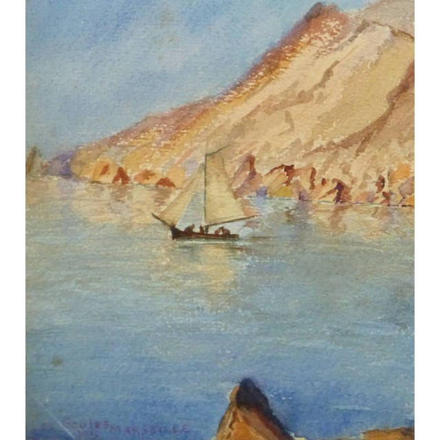 Bright watercolor landscape of a sailboat drifting in a small cove ringed by red rock mountains by artist M. Balesti',...