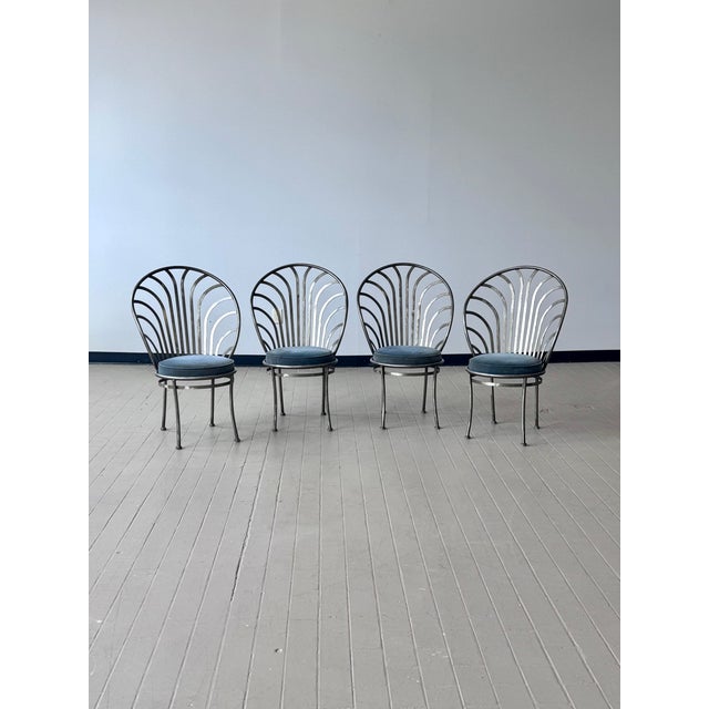 Fantastic set of four steel sculptural dining chairs. Wonderful scalloped backs. Mid-century with French Art Deco style....
