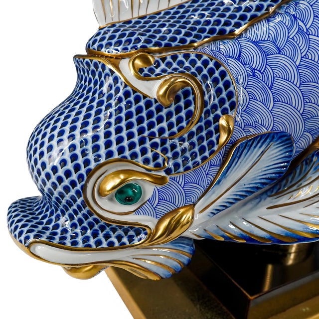 For the room that already has it all, a pair of splashy dolphin-form table lamps in blue and white hand-painted gilt...