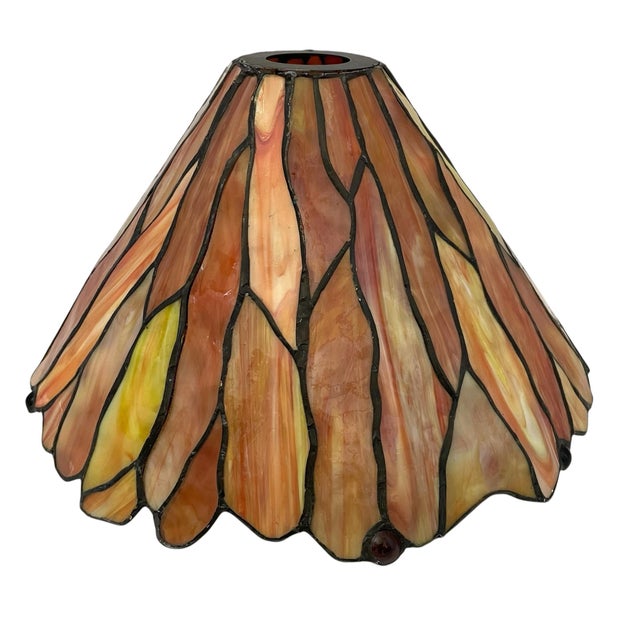 This Vintage Tiffany-Style Stained Glass Lamp Shade features a beautiful flame pattern in vibrant shades of orange, amber,...