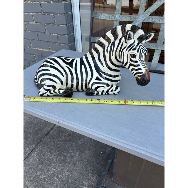 Zebra Sculpture by the Townsend in a Black and White Stripe Design .