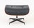 Eames Style Bentwood Footstool, with black leather upholstery on patinated metal base.1 7.25" H x 24.25" W x 21" D....