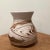 This vase bears the stamp Nemadji Pottery U.S.A., the Moose Lake, Minnesota, company that began producing swirled pottery,...