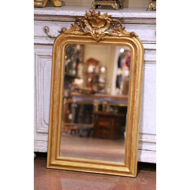 Crafted in France circa 1870, this elegant antique Louis Philippe mirror offers timeless proportions and refined...