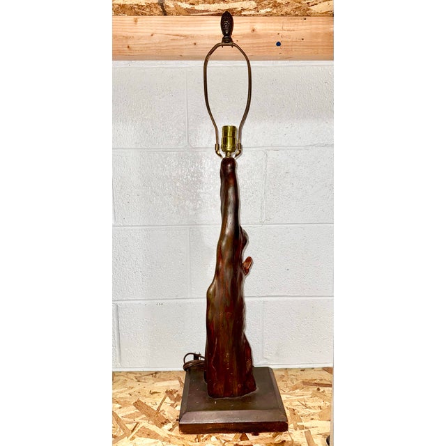 Vintage mid-century modern cypress knee table lamp. This organic piece is crafted from a natural cypress knee root, which...