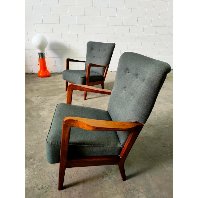 Armchairs manufactured in Denmark in the 1970s, with a teak wood frame and gray fabric upholstery. Dimensions: seat height...