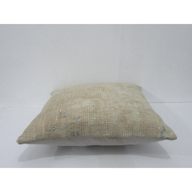 Decorative pillow cover made from a vintage Turkish handknotted rug. Backed with good quality cotton fabric. Pillow...