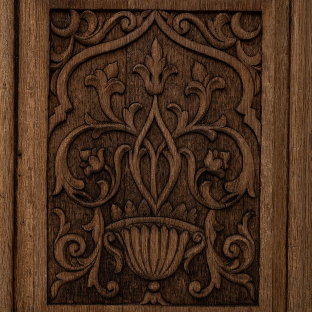 This 1970s French Gothic Revival carved oak sideboard showcases detailed craftsmanship inspired by medieval architectural...