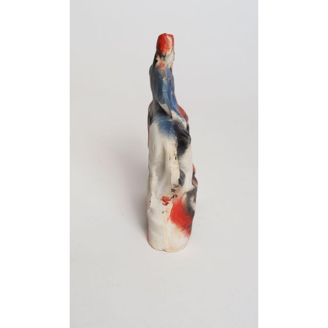 Circa 1920s Americana painted chalkware George Washington on horseback figurine in patriotic palette of red, white, and...