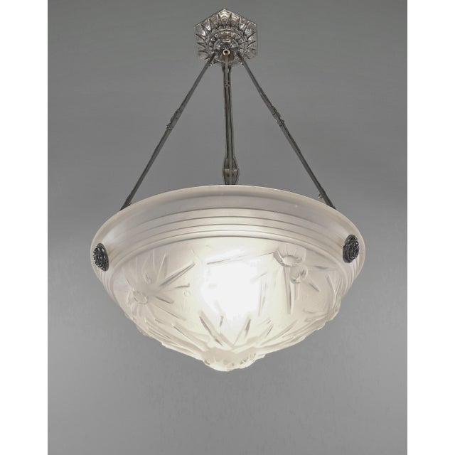 Muller frères A rare French Art Deco chandelier (c. 1925–1930) in nickel-plated solid brass or bronze, holding a glass...