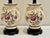 Beautiful purple and dusty pink florals on a background of crackled ivory make this pair of table lamps an eye catching...
