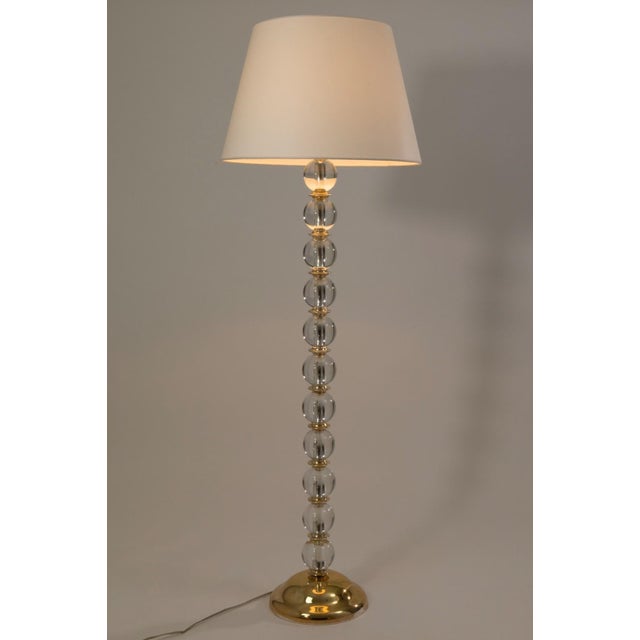 A striking example of Italian modern design, this vintage floor lamp features a slender column composed of stacked clear...