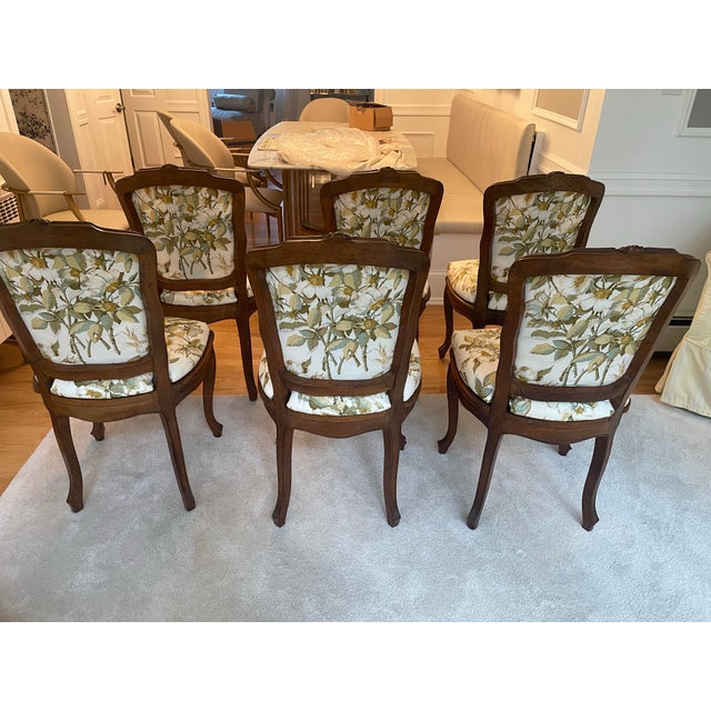 Make a statement of authenticity in your dining room with this antique set of solid walnut carved French dining chairs....