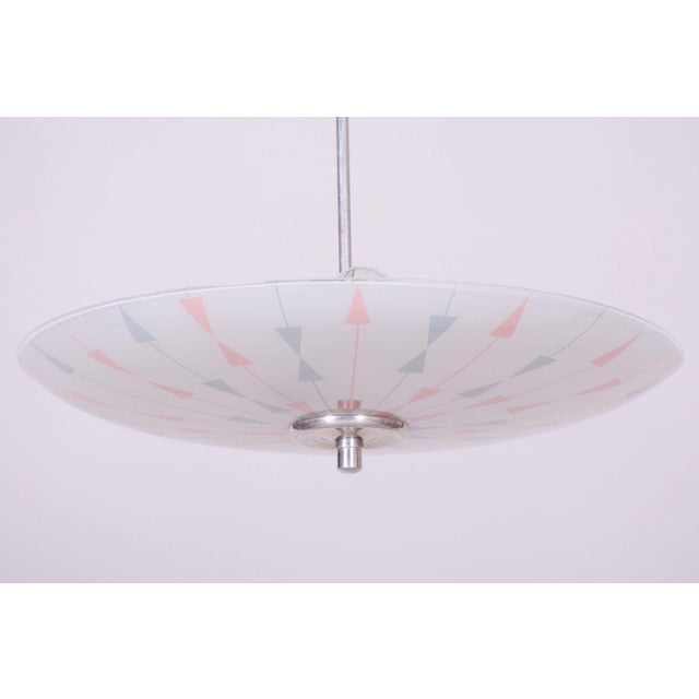 This stylish and visually captivating pendant chandelier, originating from the 1950s, represents an exceptionally...