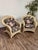 Beautifully shaped vintage wicker lounge chairs with cushions. The woven wicker detailing and floral cushions create an...