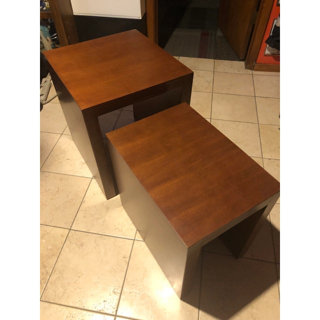Late 20 th century Arhaus set of 2 nesting table. Beautiful heavy wood tables 2in thick wood that fits perfectly inside...