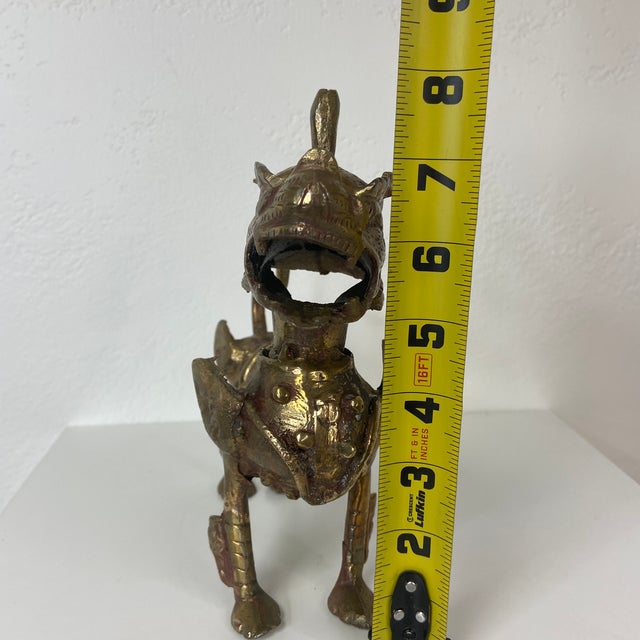 This striking mid-century Tibetan guardian lion—often referred to as a Foo Dog—features a bold, stylized form cast in...