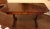 Circa 1820s sofa table in plum pudding mahogany with boxwood inlays and escutcheons. English, George IV. Opposing faux and...