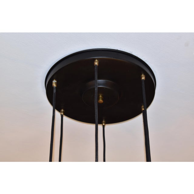 A fantastic Mid-Century Modern Italian vintage 6-light pendant by Stilnovo. The shades are designed in high-quality...