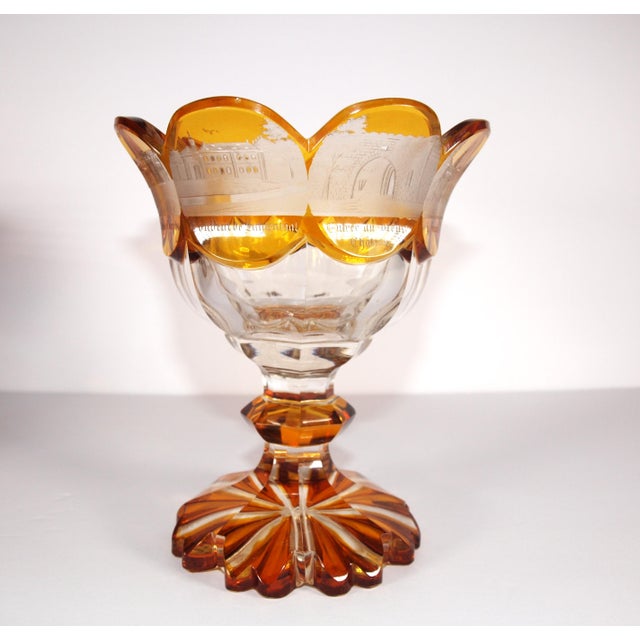 A rare German Bohemian crystal in chalice form. Dish has 8 petals on top with 7 etched engraved images of German historic...
