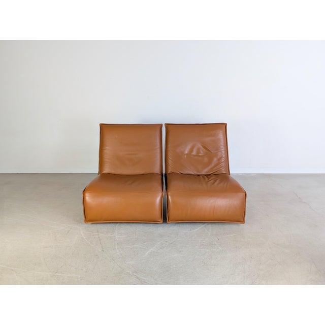 Two beautiful designer armchairs from the premium German manufacturer Koinor. The model is called Epos - Free Motion and...