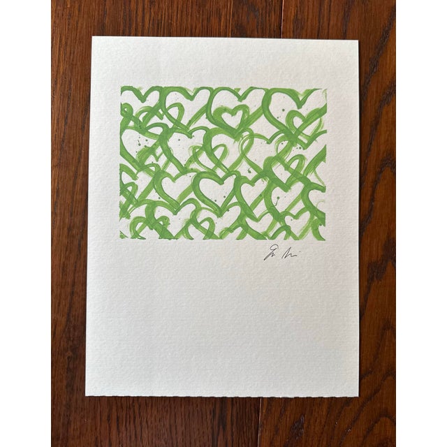 Line green hearts on paper signed on the front.
