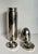 This vintage Metrokane stainless steel cocktail shaker was produced in the mid-20th century. It features a sleek bullet-...