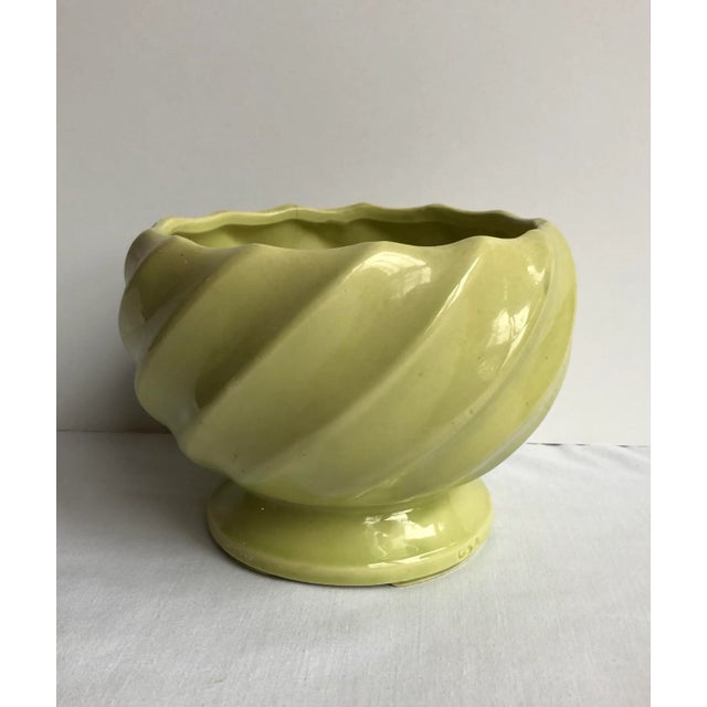 Three piece collection of avocado/chartreuse mid-century pottery. Two pieces have a “USA” mark. Pitcher: 6.5" height,...
