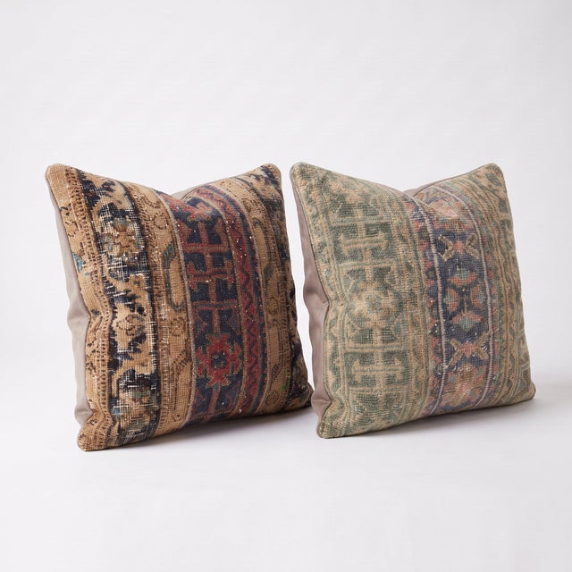This 24'' x 24'' pillow cover set was made from authentic Turkish rug pieces — geometric tribal bands in sage green and...