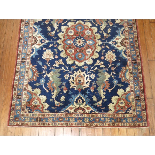Lovely early 20th century Persian Isfahan carpet with a navy blue field, accents in green and brown. Exceptional quality...