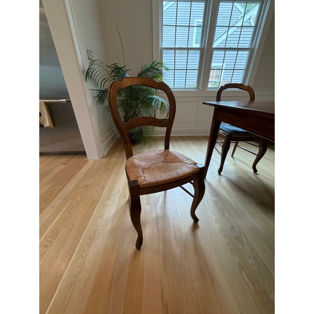 Beautiful, wood and rattan set. The chairs are pottery barn wood and rattan. The measurements of the table are 84x38x30.