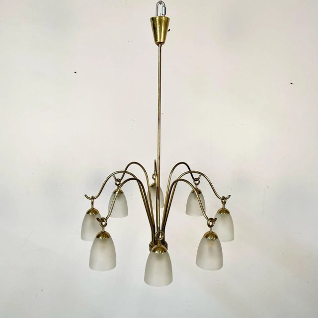 Italian Mid-Century Modern Arredoluce Eight Arm Brass Chandelier by Angelo Lelli Modern brass chandelier designed by...