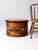 This rare large vintage wooden bandbox features a hand-painted farmhouse scene with barn red trim on the lid. Its generous...