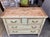 This French painted Louis XVI style chest of drawers is handsome and elegant. Made of Cherry, this piece was painted light...