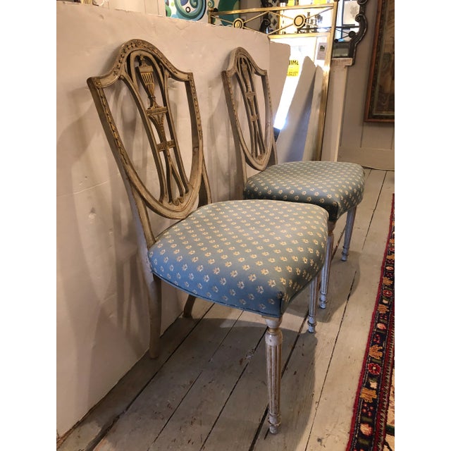 1790 French Neoclassical beautiful original grey painted side chairs with traces of old gilding, carved with acanthus...