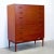 Dimensions: 36 1/4” L x 15 3/4” D x 44 3/8” H Origin: Denmark Designer: Arne Hovmand-Olsen Manufacturer: Mogens Kold...