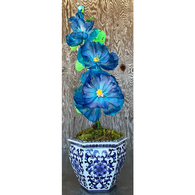 Contemporary hand-rolled paper flowers are a modern, artistic take on traditional floral arrangements. These flowers are...