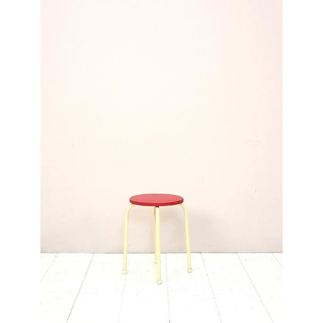 Scandinavian Stool 1960s. Consisting of a bearing structure in white painted tubular metal and a padded and red -like seat...