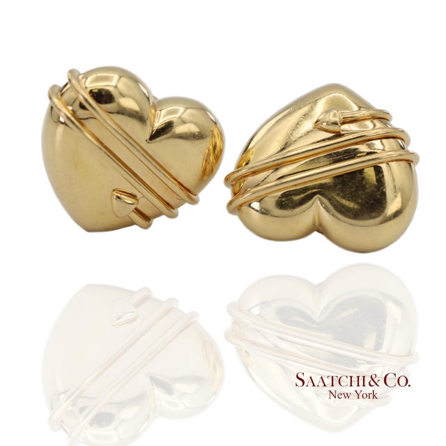 Tiffany & Co. Yellow Gold Arrow Wrapped Heart Earrings Metal Type: 18k Yellow Gold Total Item Weight: 18.5 Grams...